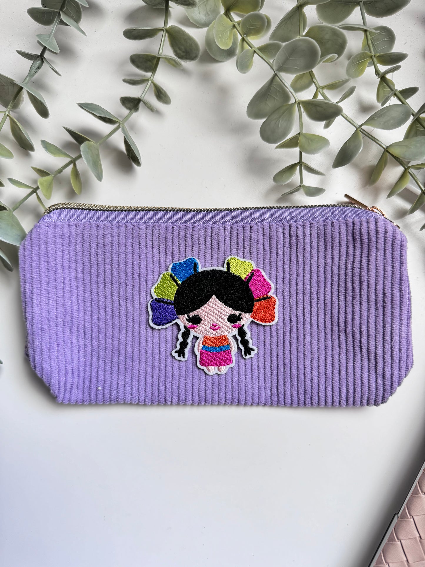 Muñeca Pouch